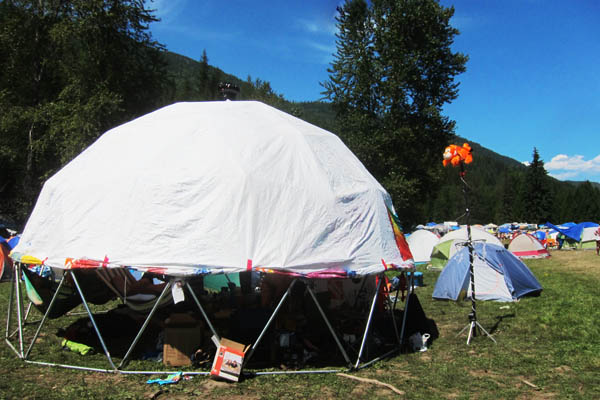 Our geodesic dome, with Tyvek cover rolled partway up, and Tigger totem